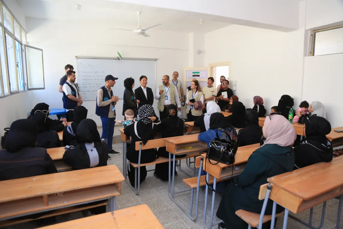 H.E. the Ambassador of the Republic of Korea along with officials visit a classroom filled with school children in the rehabilitated Al-Kifah School in Aleppo