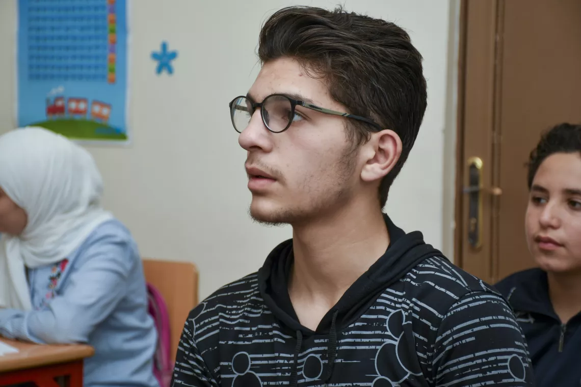 Khalil, 17, attends a Grade 9 science revision session.