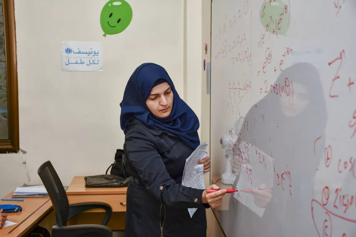 Ms. Rama, a teacher, leads a Grade 12 mathematics revision session.