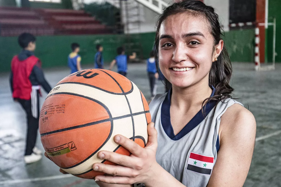 Girl holding a basketball