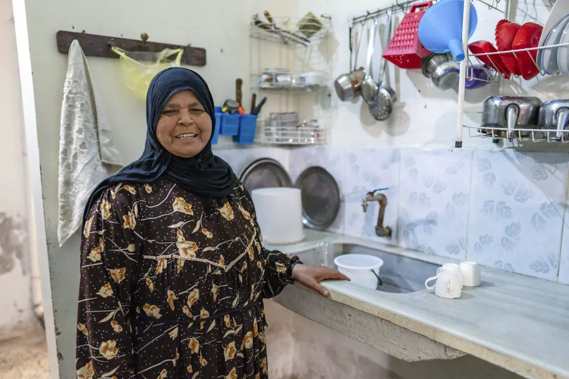 Woman smiling at kitchen 