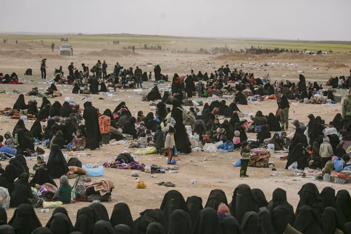 women and children collected in desert