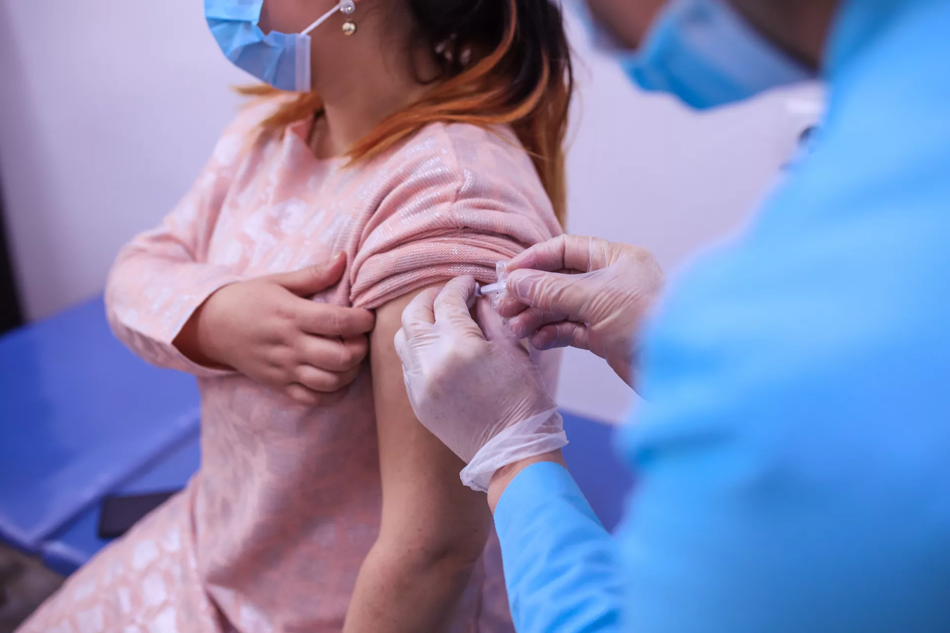 A woman getting her vaccine shot in Dushanbe 
