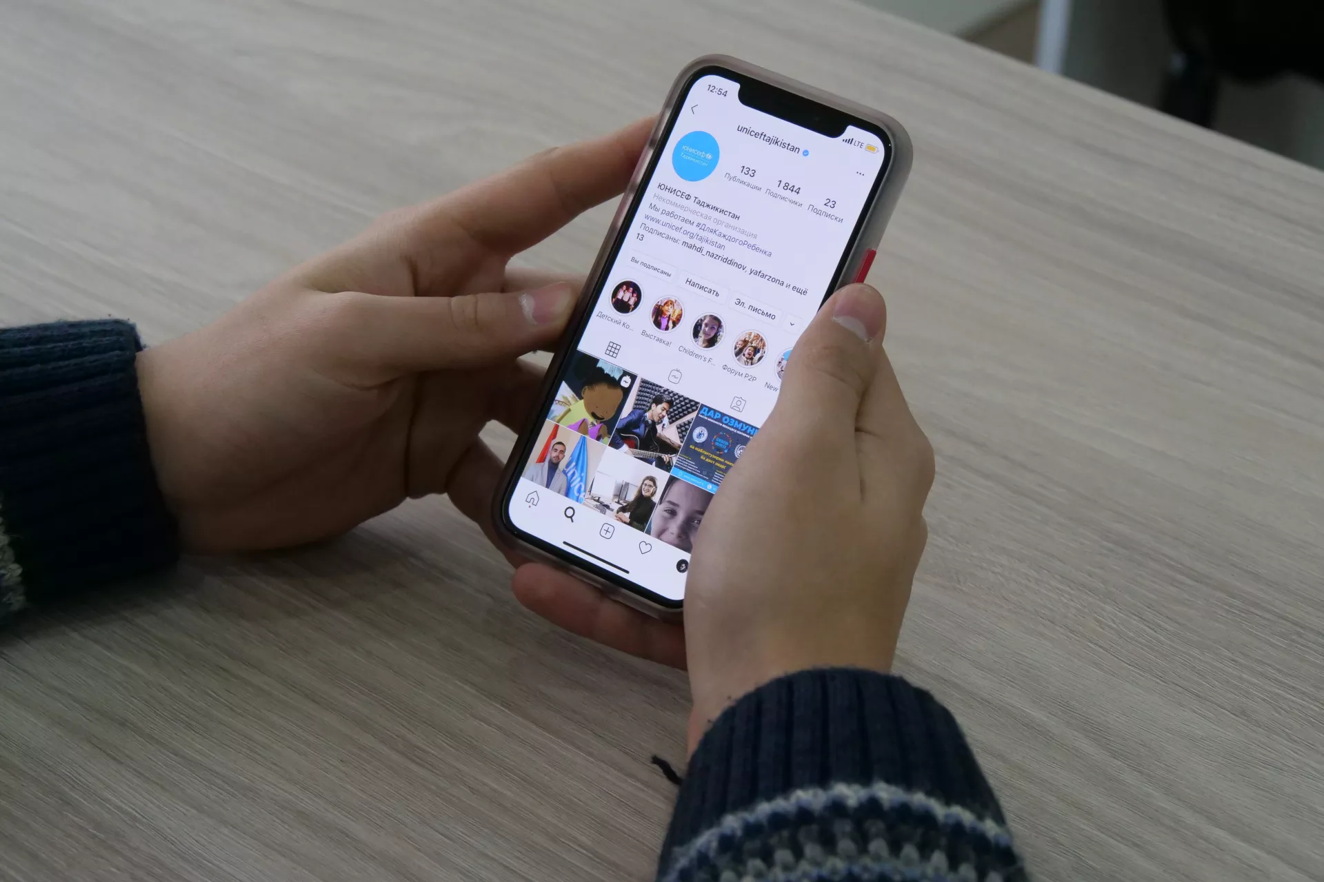 hands holding smartphone