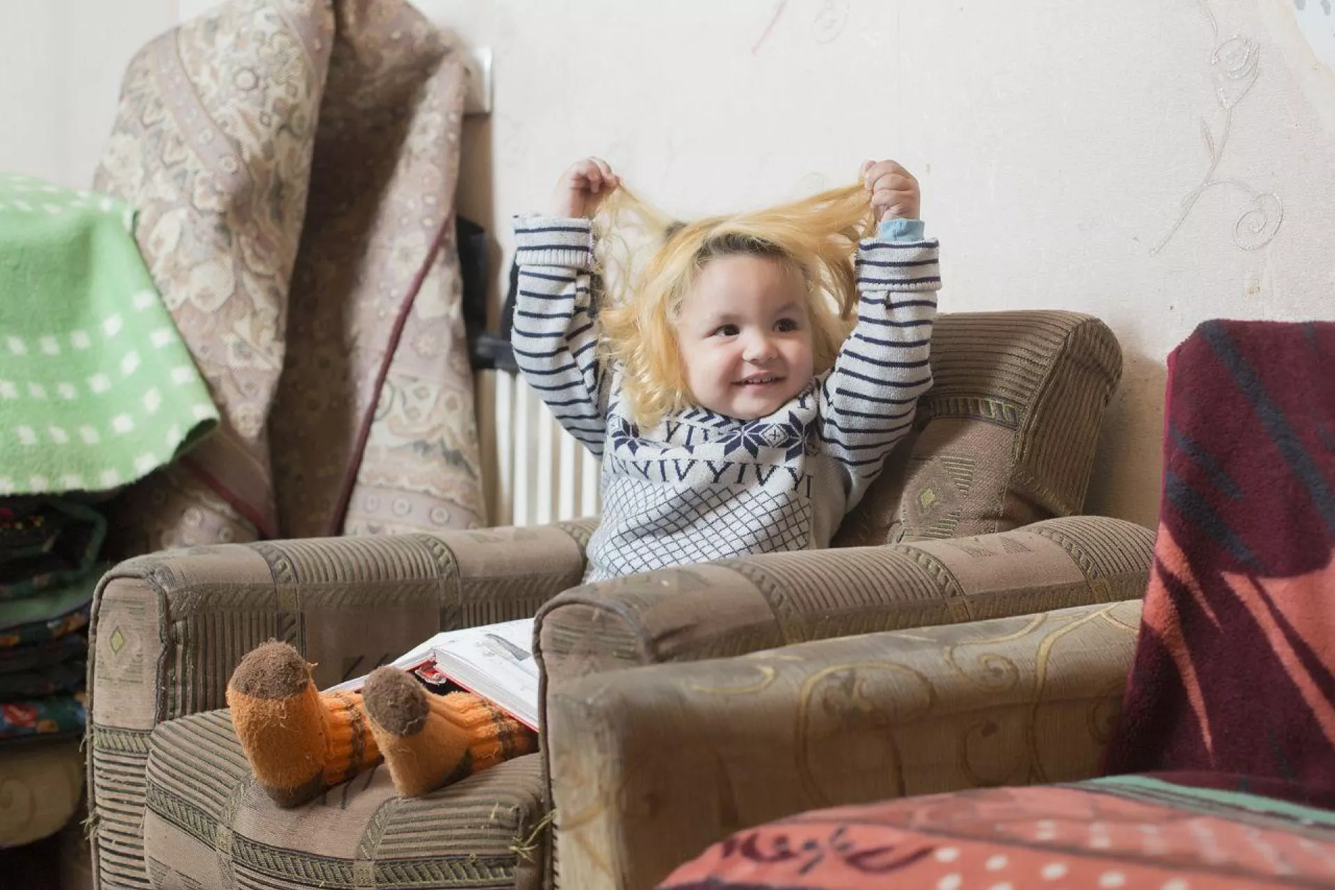 baby girls sitting on a sofa 