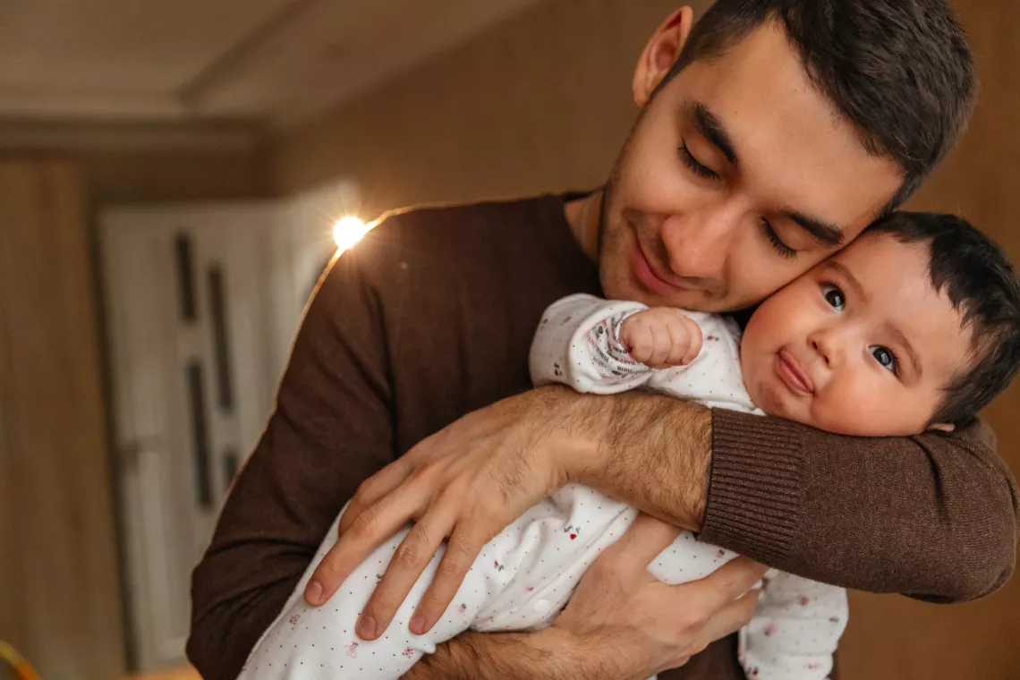 Father holds his baby girl
