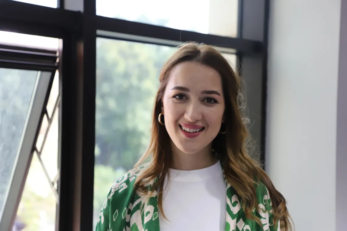 A woman looking at the camera smiling