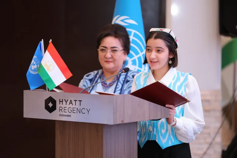 Sumaya is speaking at the podium during the IDGC 2026