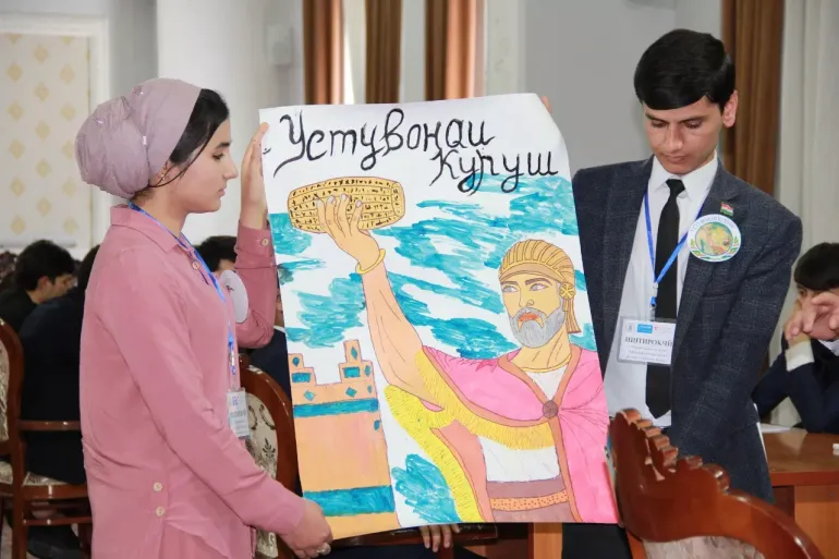students holding a poster 
