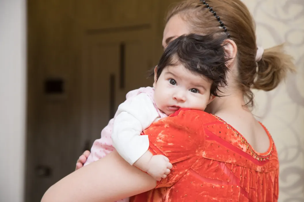 Mother holding her child
