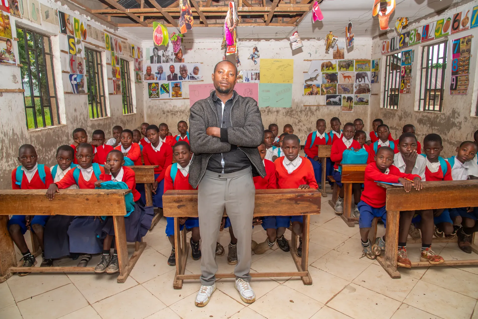 Head Teacher Gaithan, with COBET students at Nyenjele Primary School.