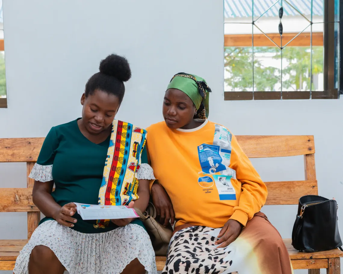 Ray Kimeme walks to her local health facility in Kishapu District, where she is receiving antenatal care during her second pregnancy. With reliable solar-powered electricity, the facility is now equipped to provide safe, consistent care.