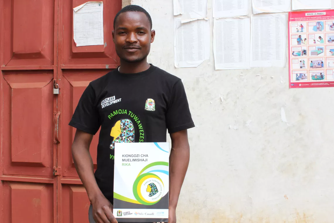 A man standing in front of a health facility