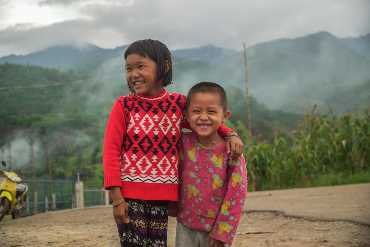 A girl and a boy are standing next to each other