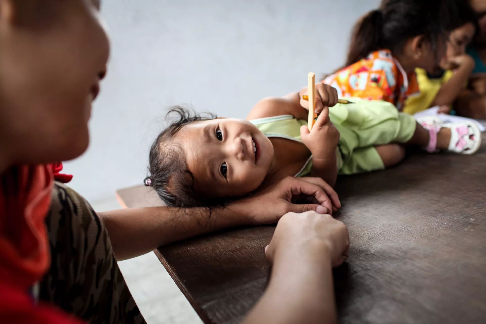 Caregiver and child smiling