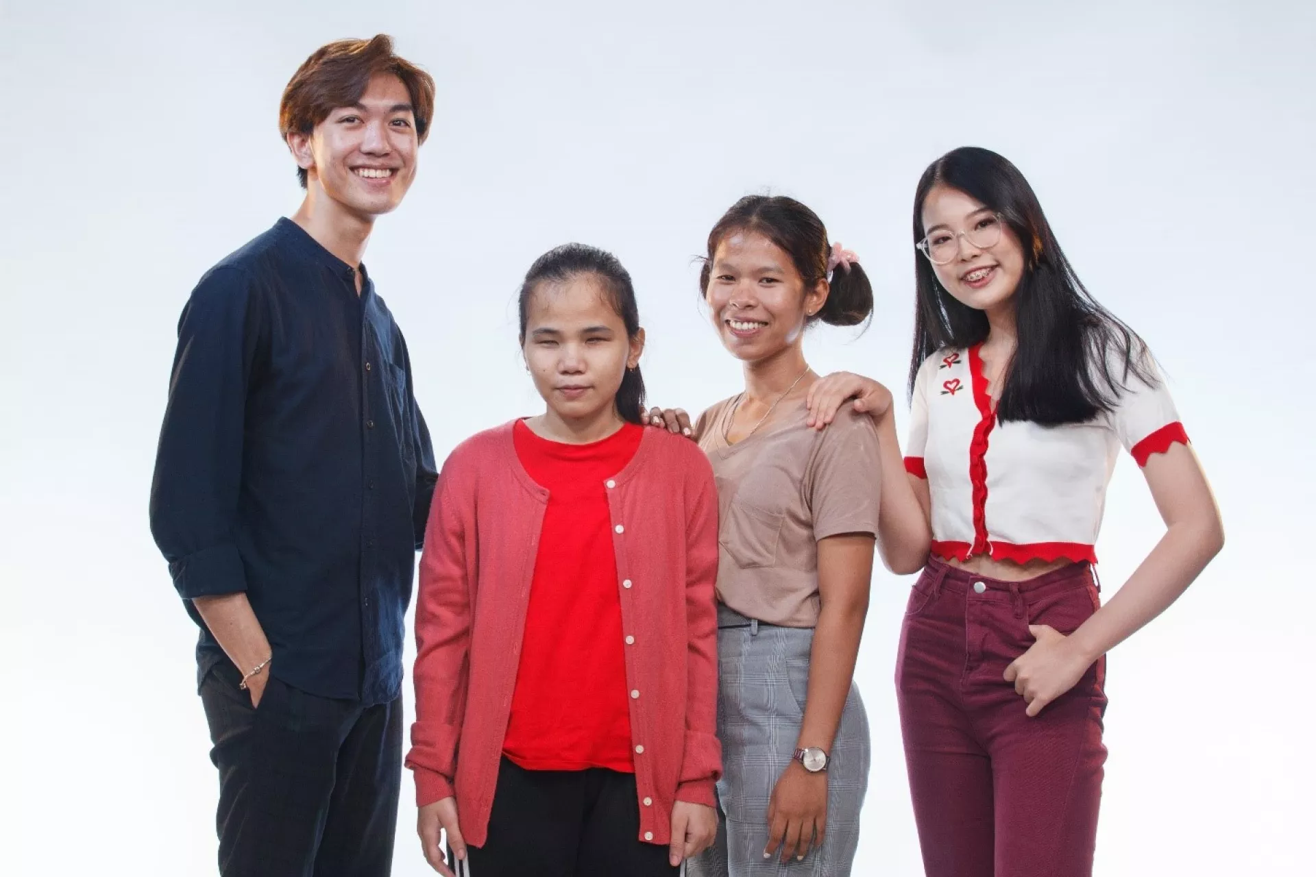 A group photo of young people who shared their stories on UNICEF's The Sound of Happiness special episodes. From left to right: Ame Ammarin Boonsaard, Palm Kamollug Tongdang, Oo, and Ya Prachaya Sirimahaariyapoya.