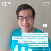 A man wearing glasses is smiling brightly against a plain beige background. He is dressed in a turquoise shirt with Thai text that translates to &amp;quot;I am a volunteer.&amp;quot; The text reads, &amp;quot;I&rsquo;m a UNICEF volunteer because I want to plant a seed called &lsquo;helping others&rsquo; in people&rsquo;s hearts, just as my mother once planted it in mine. - Maninthares Tansathien.&amp;quot; Additional text includes, &amp;quot;A Better Tomorrow Today&amp;quot; in the top left corner and &amp;quot;UNICEF for every child&amp;quot; in the top right corner.