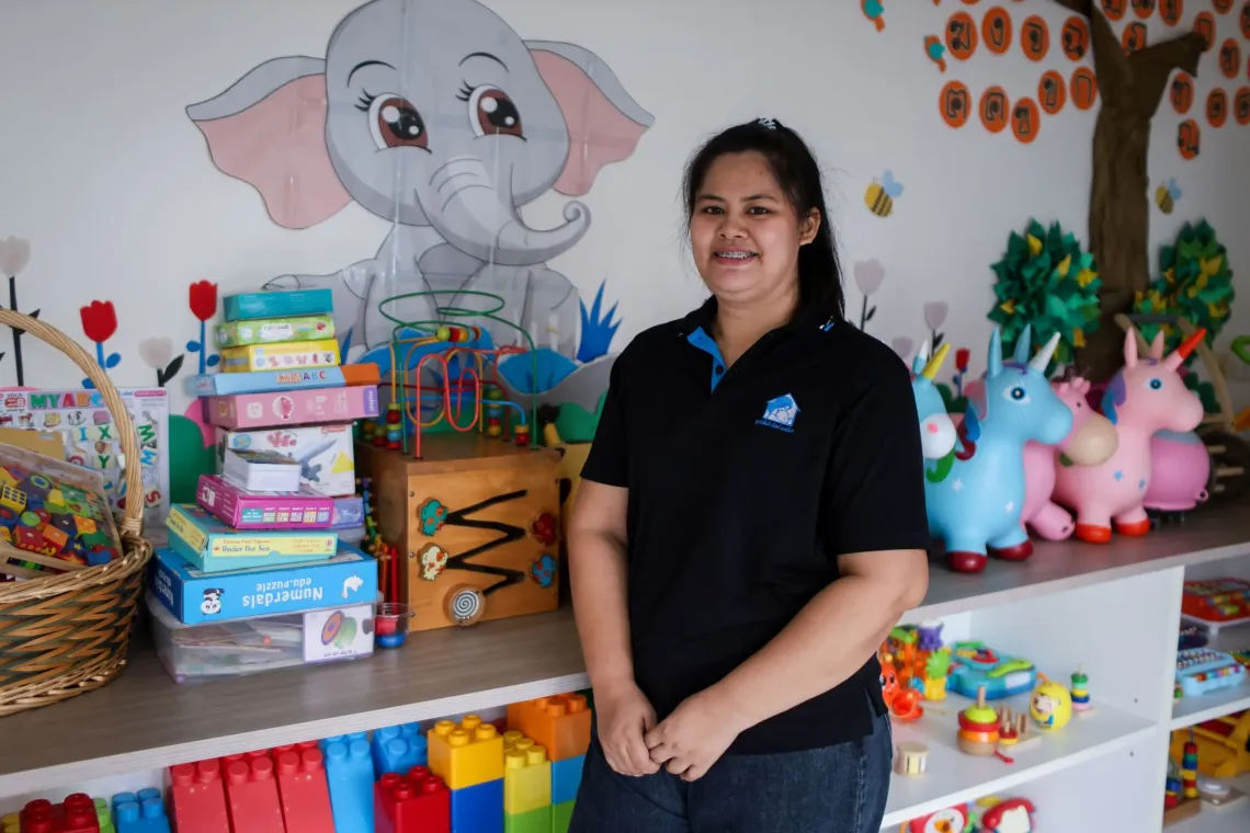 A woman standing in a ECD centre.
