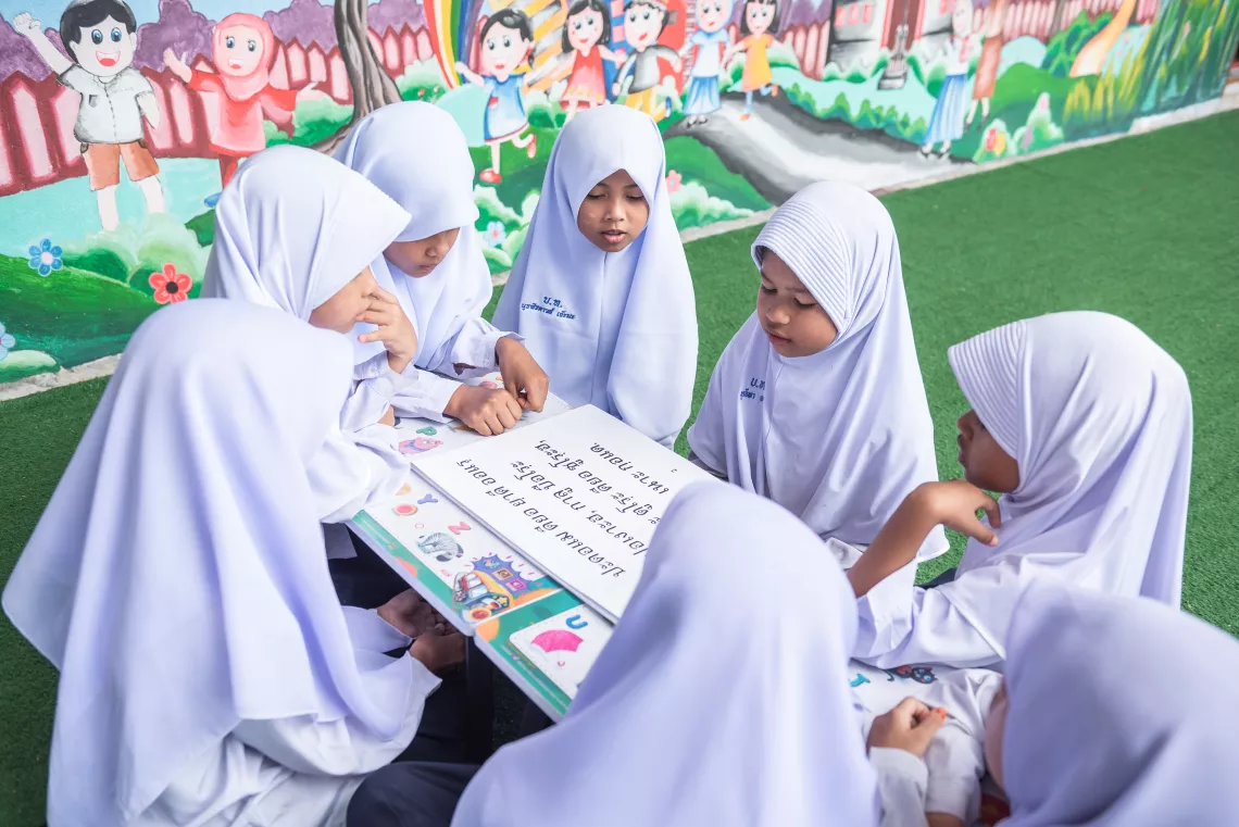 Students at Ban Buathong School in Than To district of Yala province are reading books together.