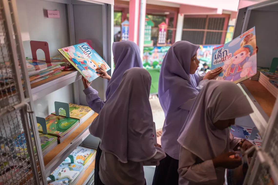 Young students are picking up their favourite books from the Mobile Library.