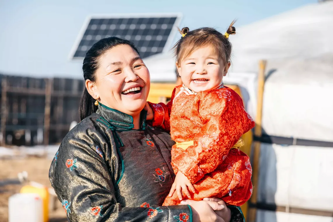 Munkhsurn and her daughter in front of the family ger