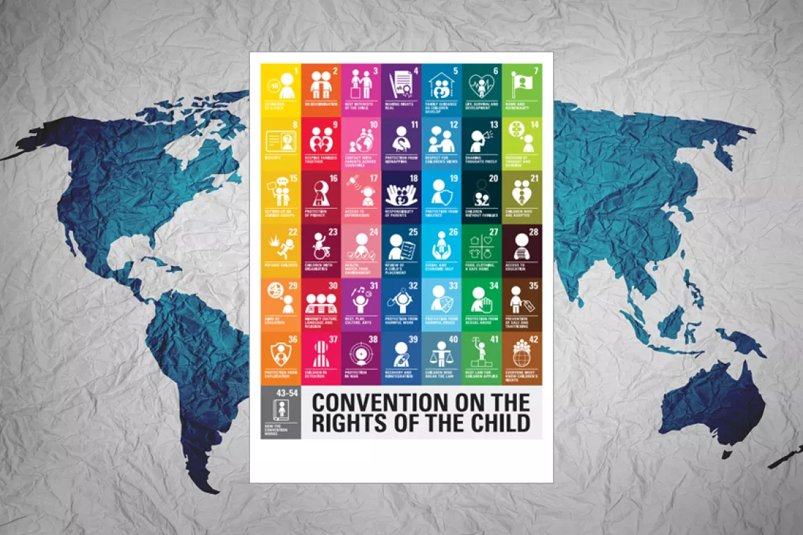 A cover of Convention on the Rights of the Child with world map as a background.