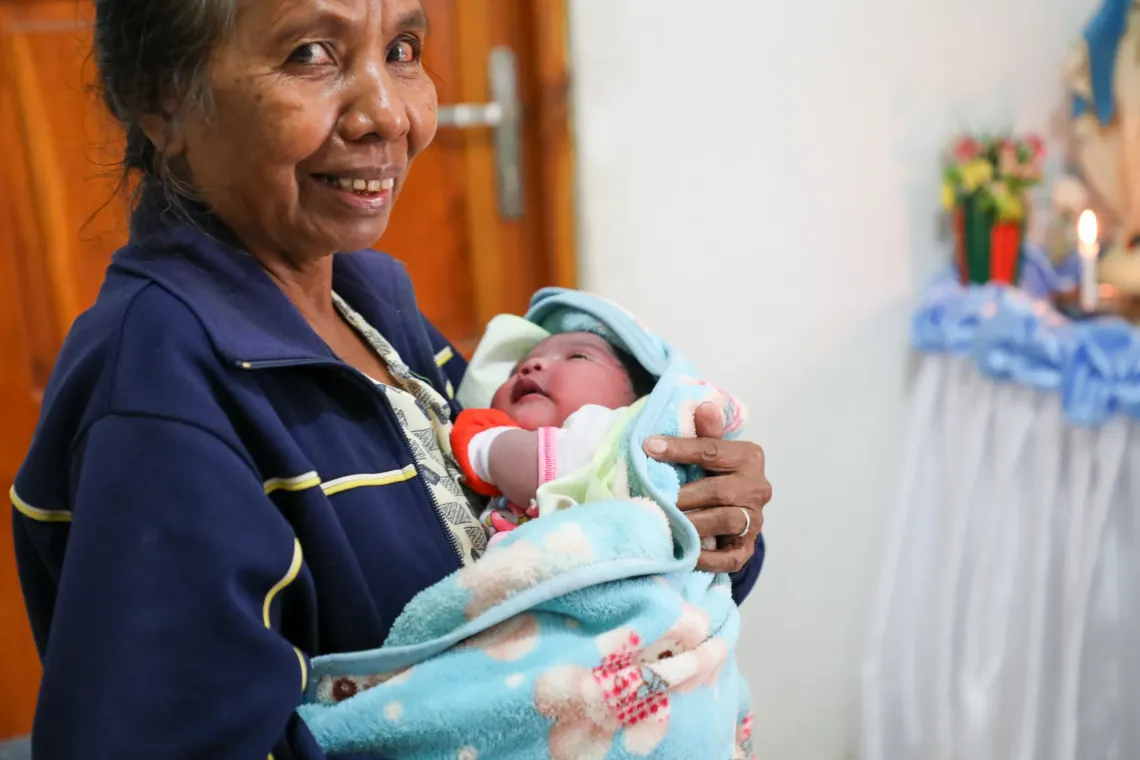 Maia looks up at her grandma. 