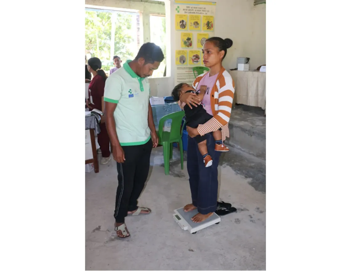 As an MSG member in Baha-Mori, Julio measures children aged five years and below and coordinates with health professionals to ensure each child's handbook is filled in correctly.