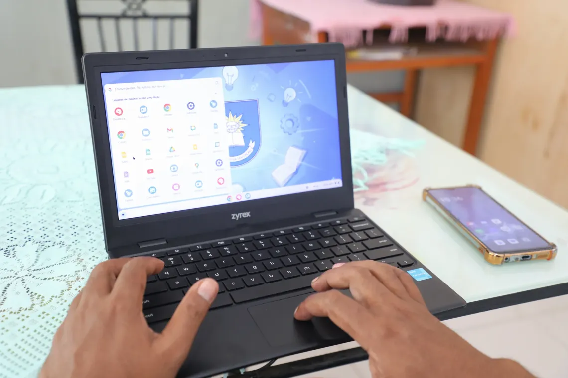 Jaime accesses a Google Chromebook at EBC 3 Maubara. 