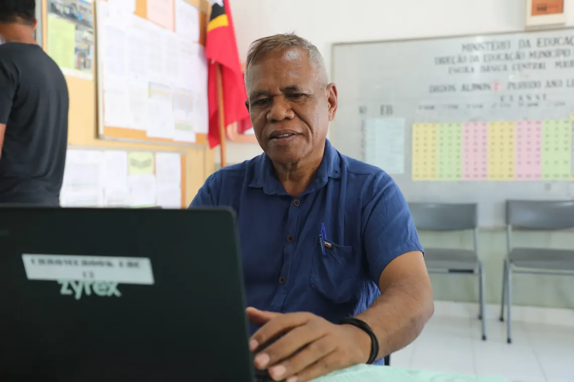  Jaime Serr&atilde;o Nunes uses a Google Chromebook to prepare teaching materials at EBC 3 Maubara .