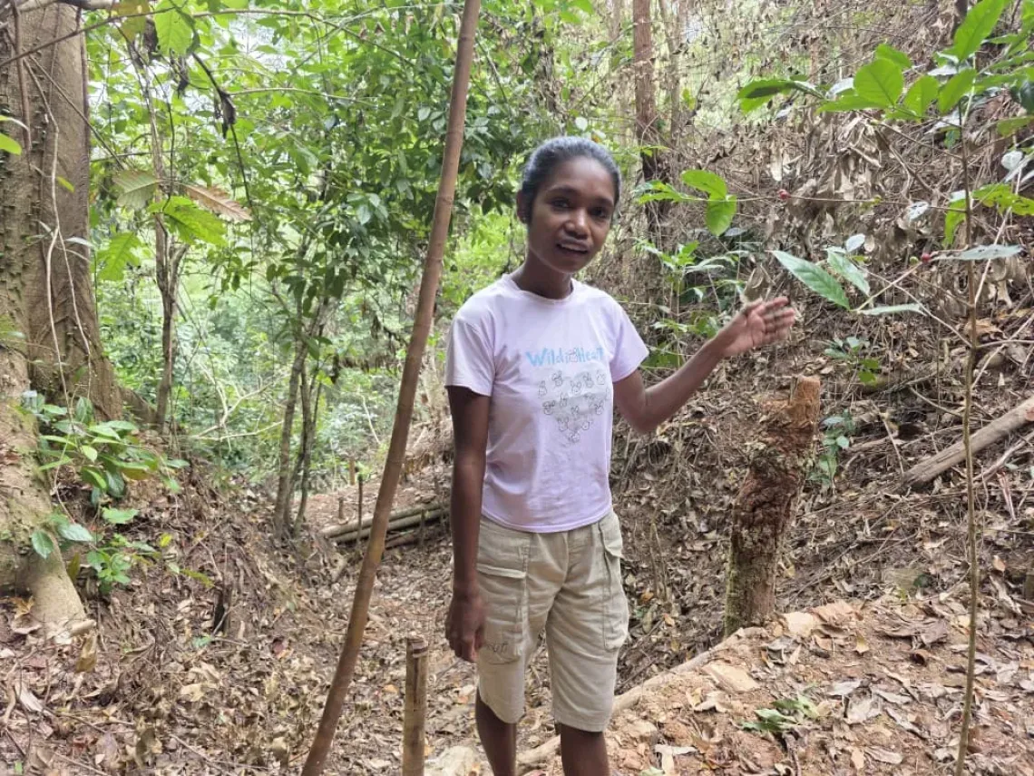 Etelvina shows natural check dams that she and the Tuileso community built. 