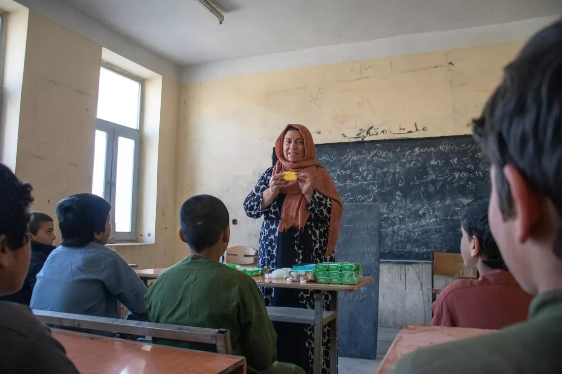 In Badghis province, western Afghanistan, a teacher talks to her class about why good hygiene is important