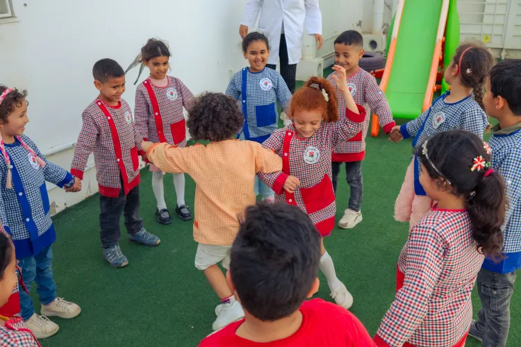 children in a kindergarten in the city of Borj Louzir are playing in the playground/ Ariana, Tunisia 