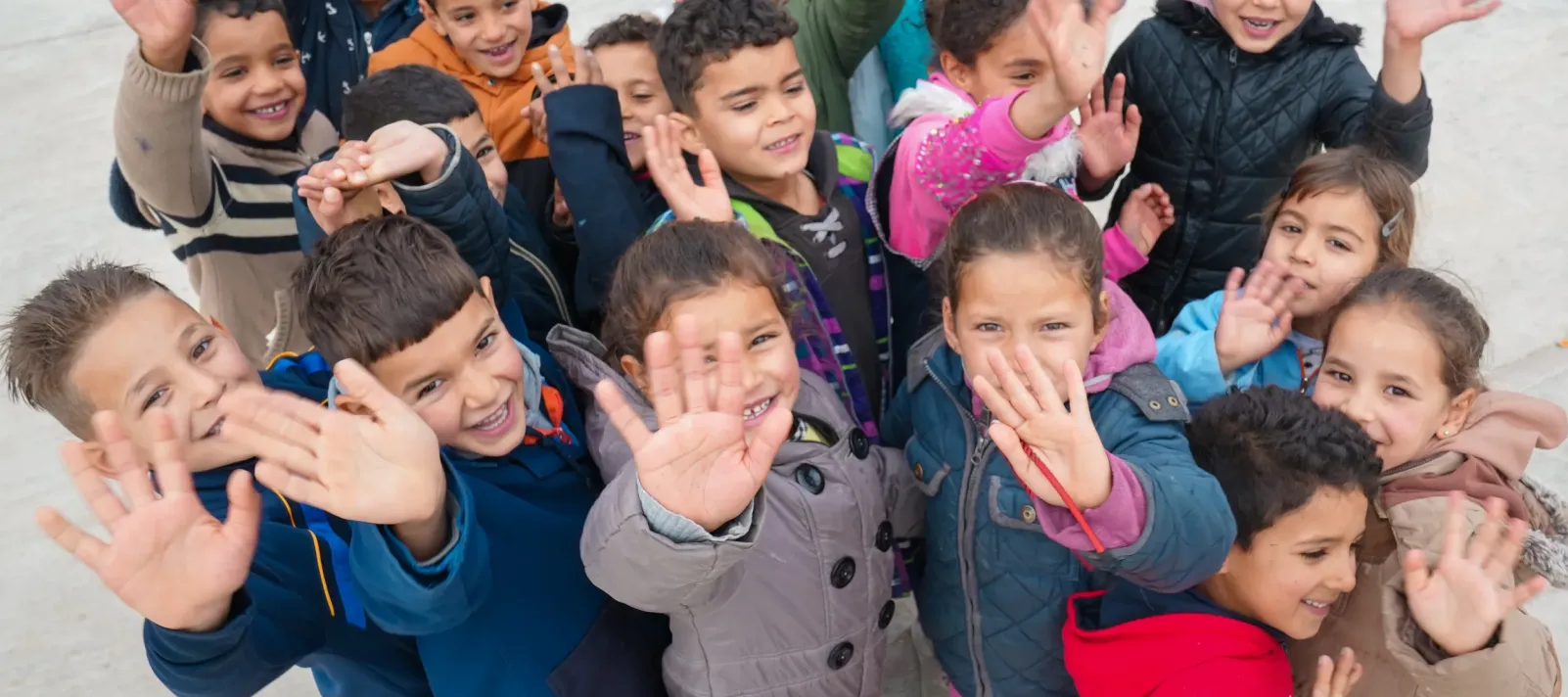 Children play and interact on their primary school grounds in Gaafour, Siliana, Tunisia, as part of their extracurricular activities.