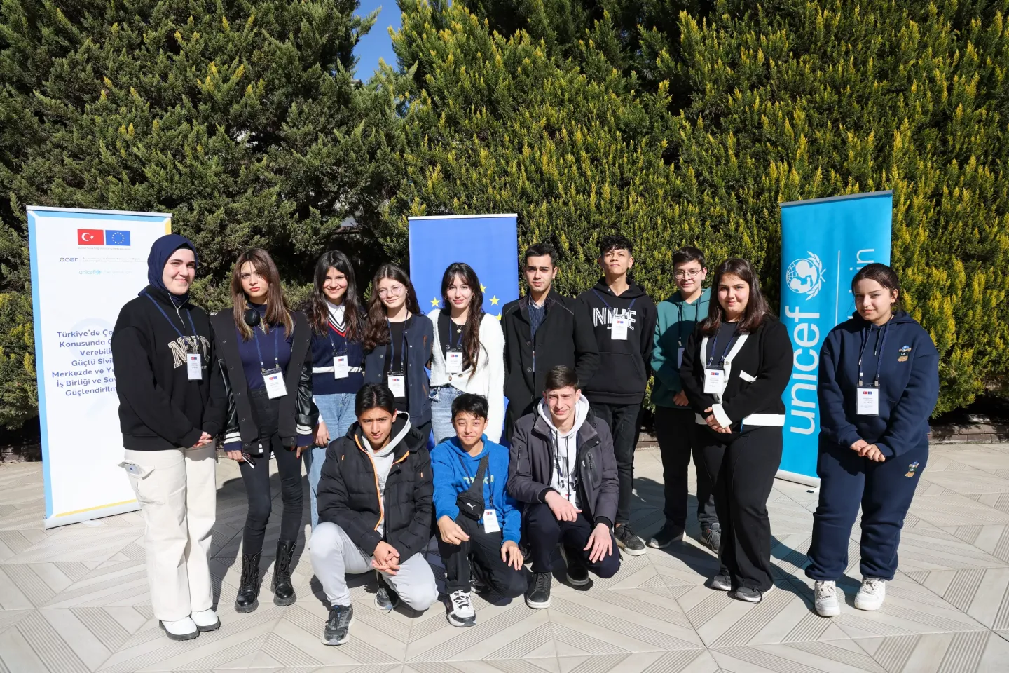 Young participants of ACAR Workshop are posing in the garden.