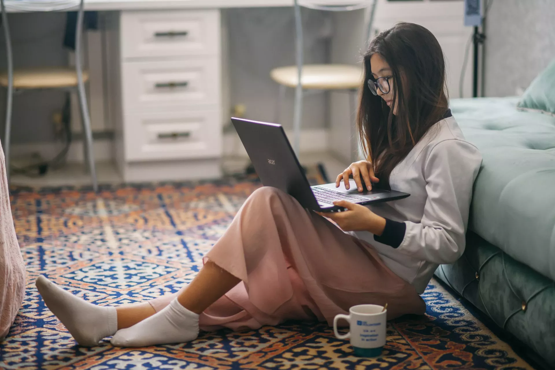 A teenage girl who spends time online with her computer.