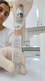 A member of Team Inspire works on a project in a science lab setting.