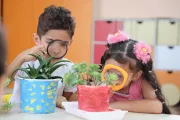 boy and girl observing plants