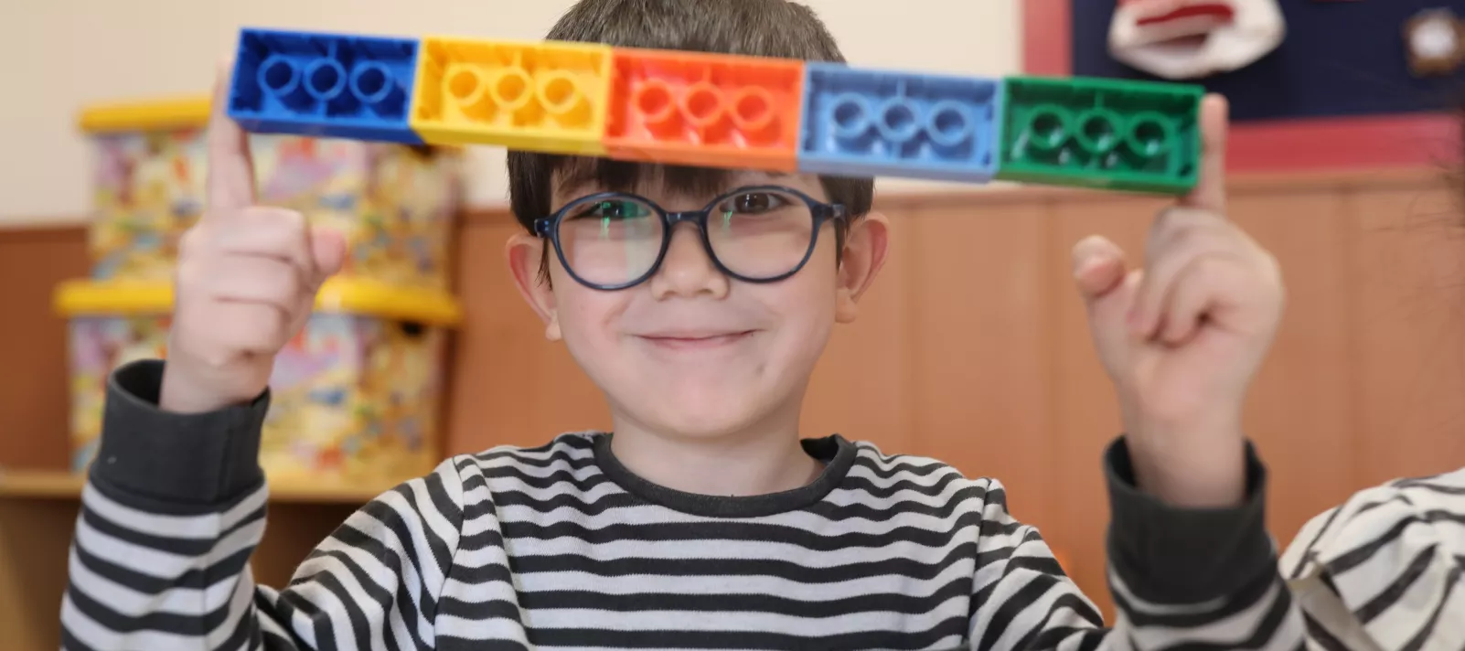 Boy holding legos