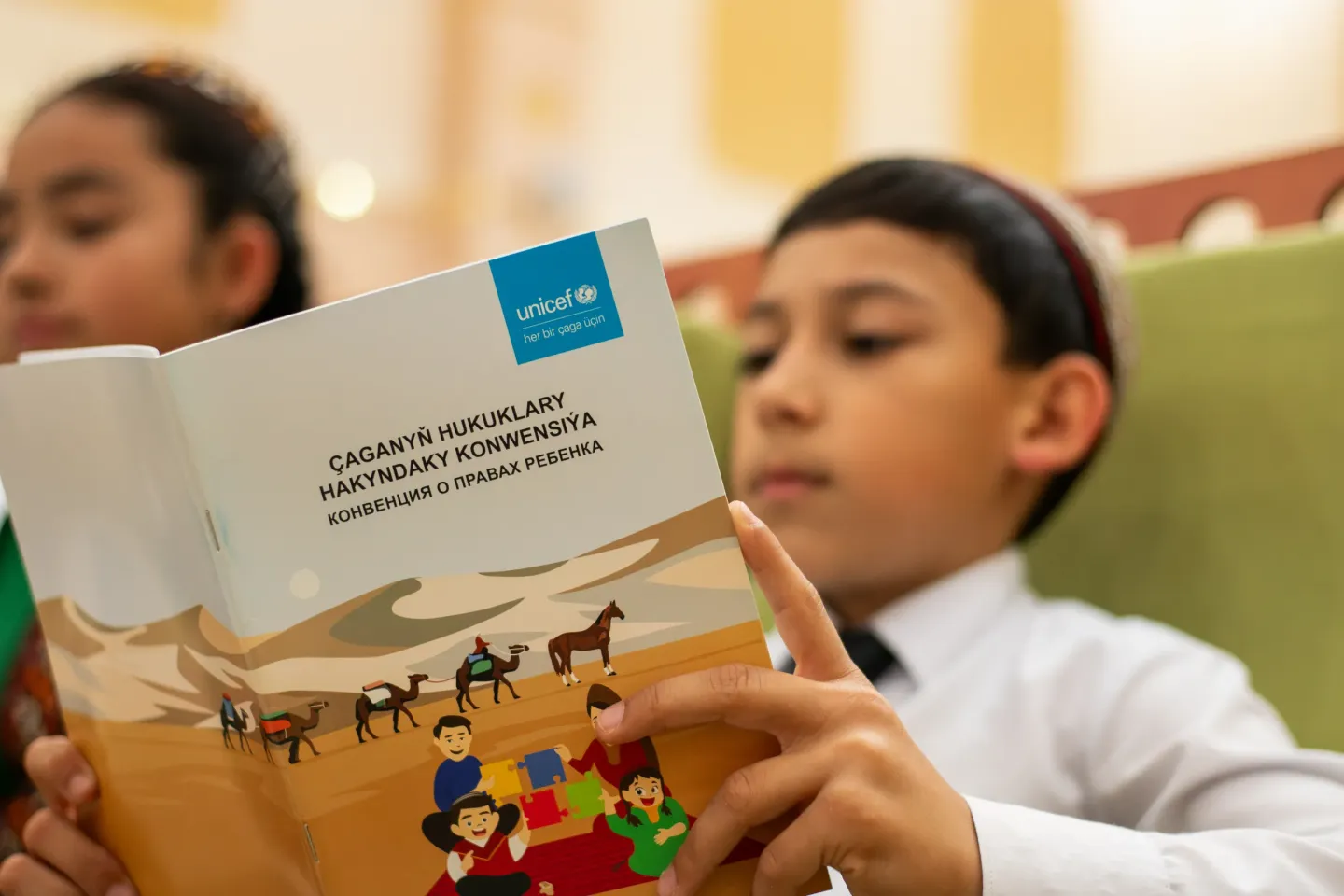 A child reading Child rights convention