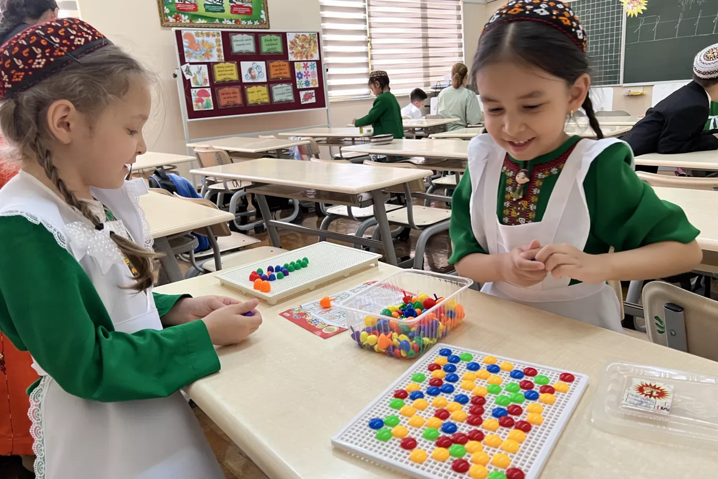 Two students are playing a board game