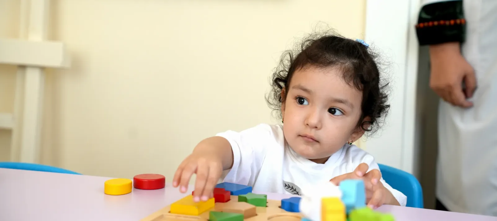 A girl child playing with toys