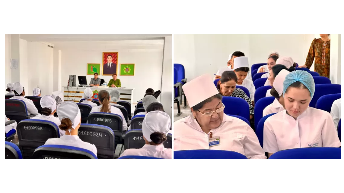 A group people sitting in a meeting room