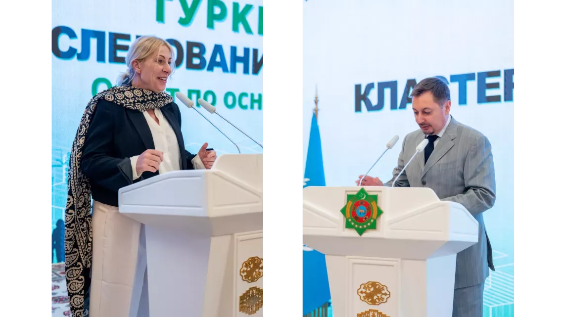 A man and a woman speaking from the tribune