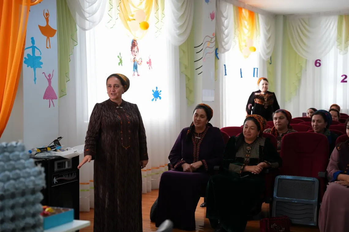 Preschool teachers and education specialists participate in a professional development session supported by UNICEF.