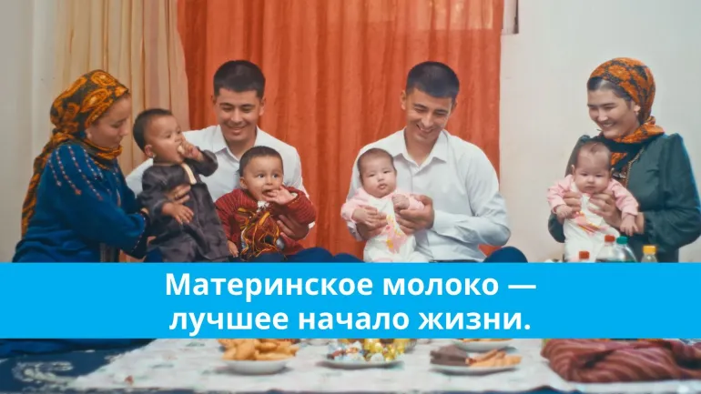Parents sitting and holding babies