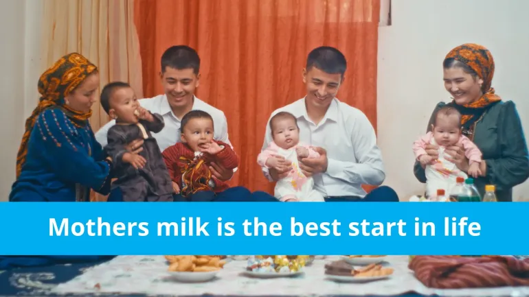 Parents sitting and holding babies