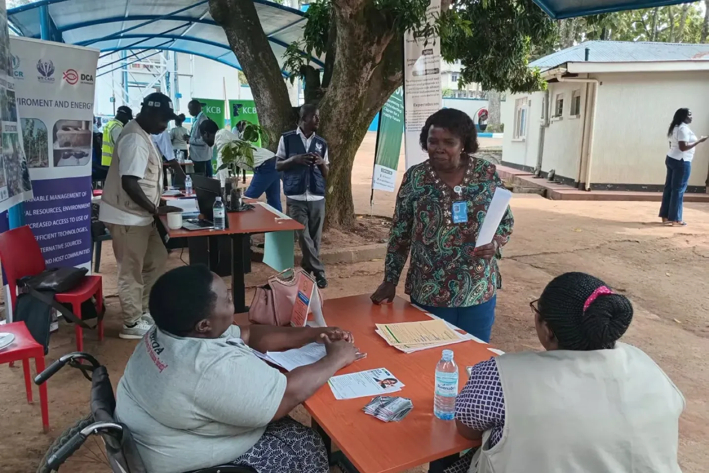 Claire and Annette presenting the work to a UN agency partner during Arua marketplace