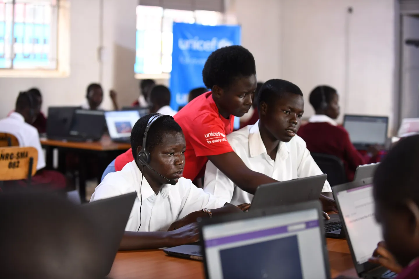 Students at St. Mary Asumpta Girls Secondary School Pekelle in Adjumani district attend a biology lesson online during the launch of the UNICEF and Airtel Africa partnership.