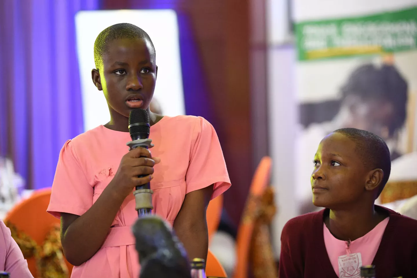A pupil from Kasubi Church of Uganda Primary School participate in the launch of the National Coalition to End Child Poverty in Uganda.
